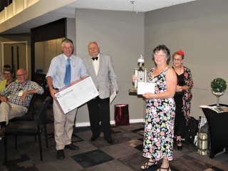 Gordon and Beryl Duthie receiving prize from Winton Cleal assisted by Ruth again